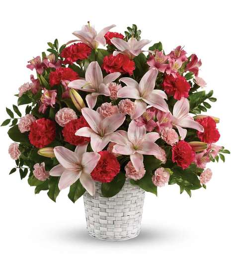 Serenely elegant, this radiant bouquet of fragrant pink lilies and other floral favorites is a lovely choice for the service, as well as a thoughtful gift for the home