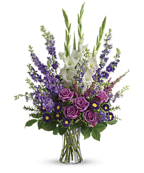  Cherish your memories with this lasting remembrance of lavender larkspur and roses, deep purple asters, pure white gladioli and the softest pink heather