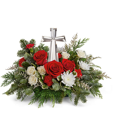 red and white floral arrangement with crystal cross