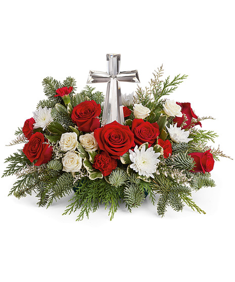 red and white floral arrangement with crystal cross