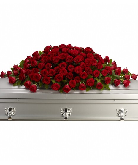 red roses in large casket spray