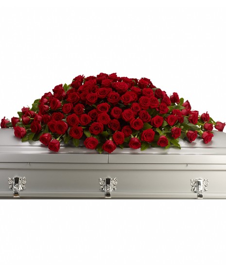 red roses in large casket spray